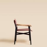 Maërl armchair, Galathée model, red leather, solid wood armrests of your choice