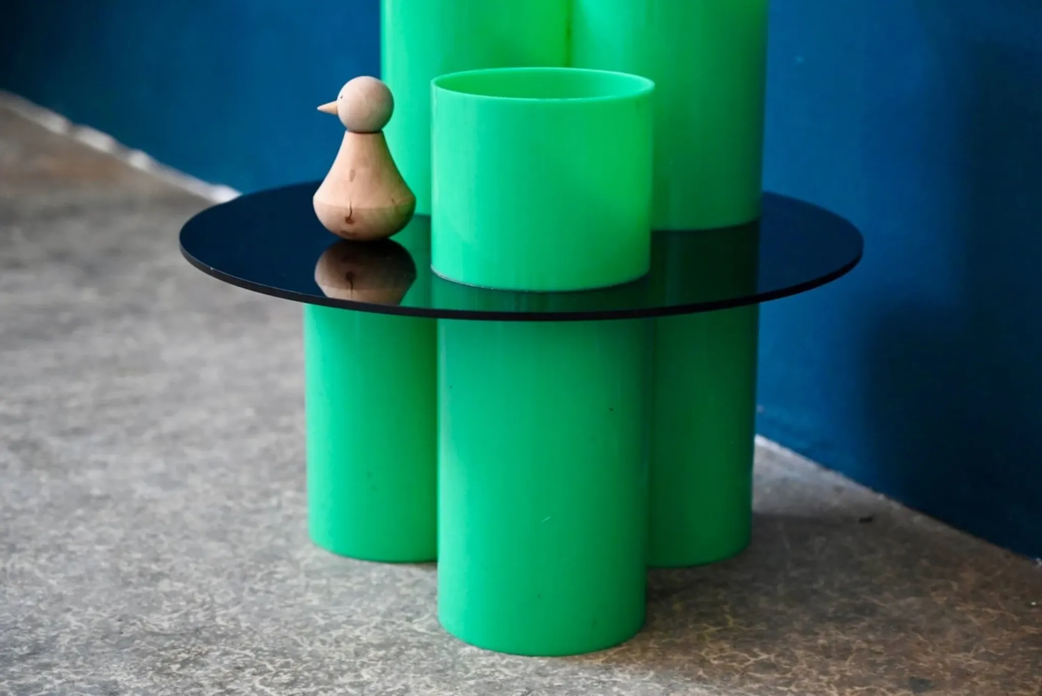Green plexiglass coffee table in Memphis design style from the 1980s.