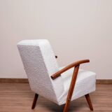 Vintage armchair in pearl white bouclé with walnut wood, 1960.