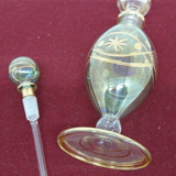 Vial / perfume bottle in tinted and cut glass golden border