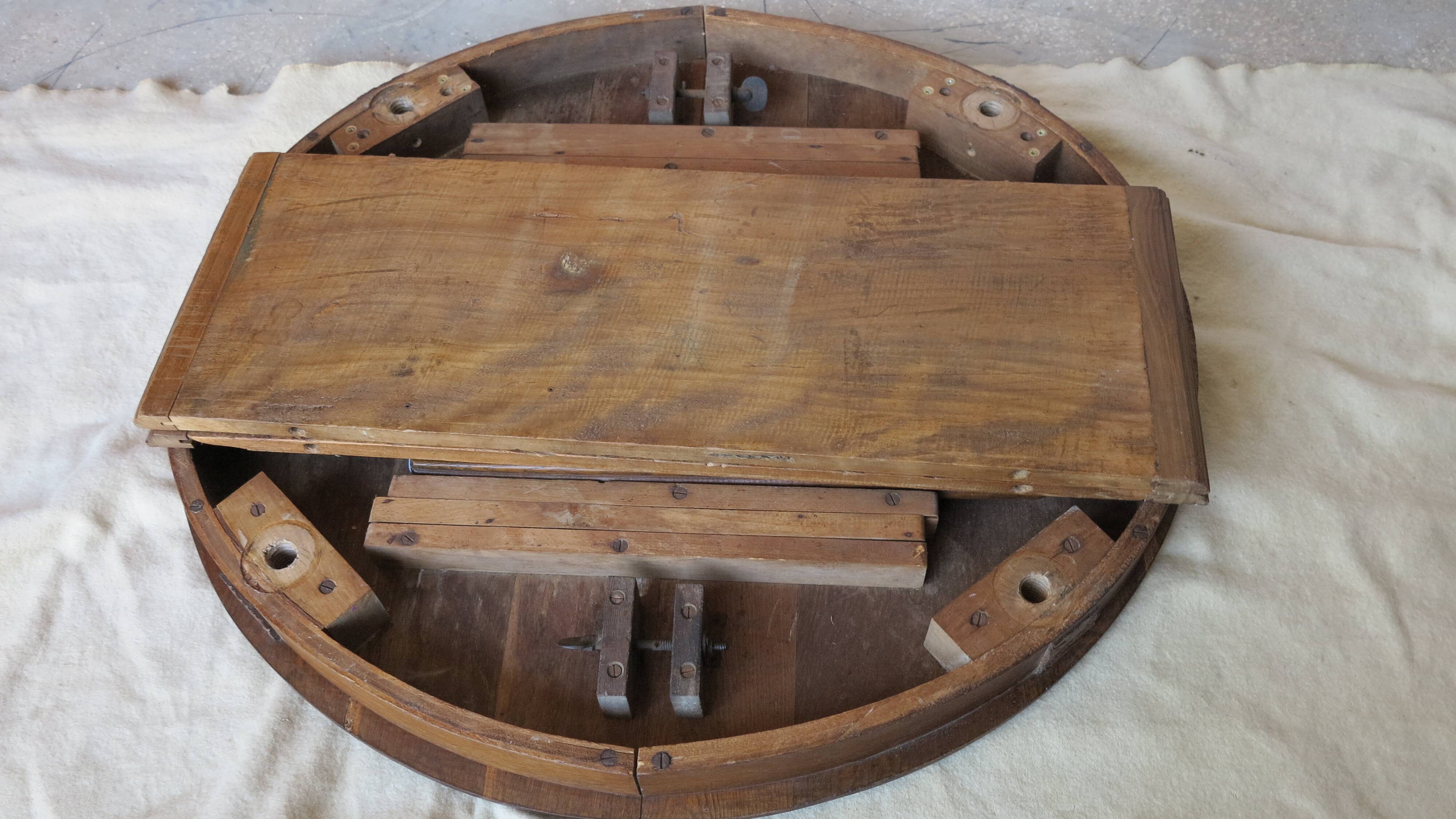 1930s oak dining table, slightly oval.