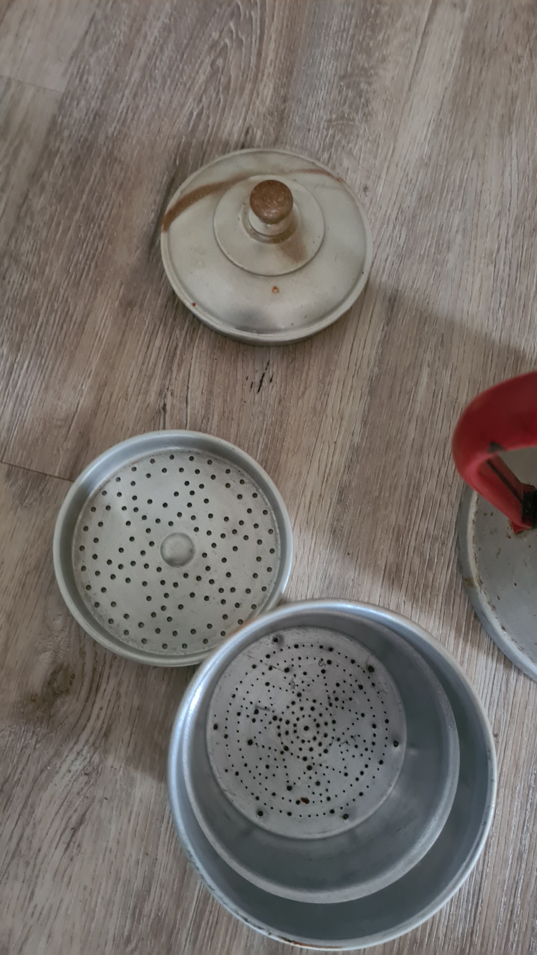 Old enamelled coffee maker in red handle aluminum