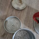 Old enamelled coffee maker in red handle aluminum