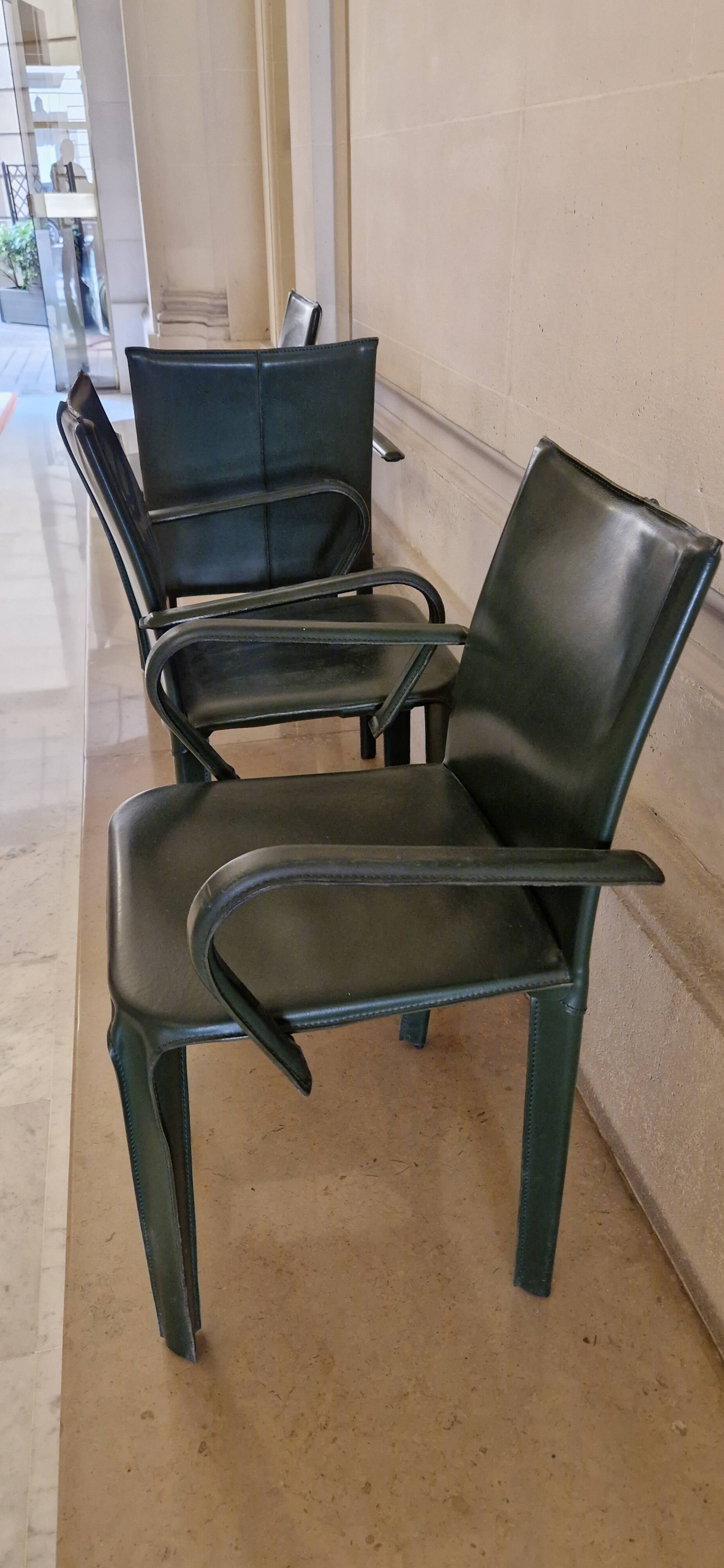 Set of 4 green leather chairs