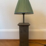 Vintage stone lamp with green pleated shade.