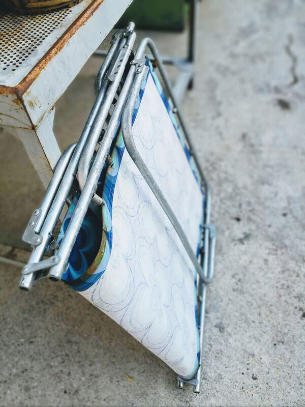 Camp bed or vintage sunbathing