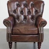 Classic grained cognac colored cowhide leather Chesterfield armchair