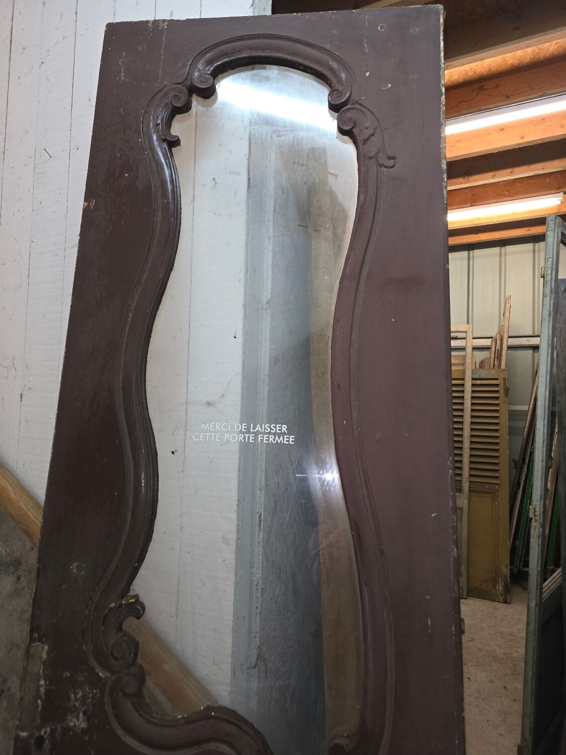 Old glass shop door in oak