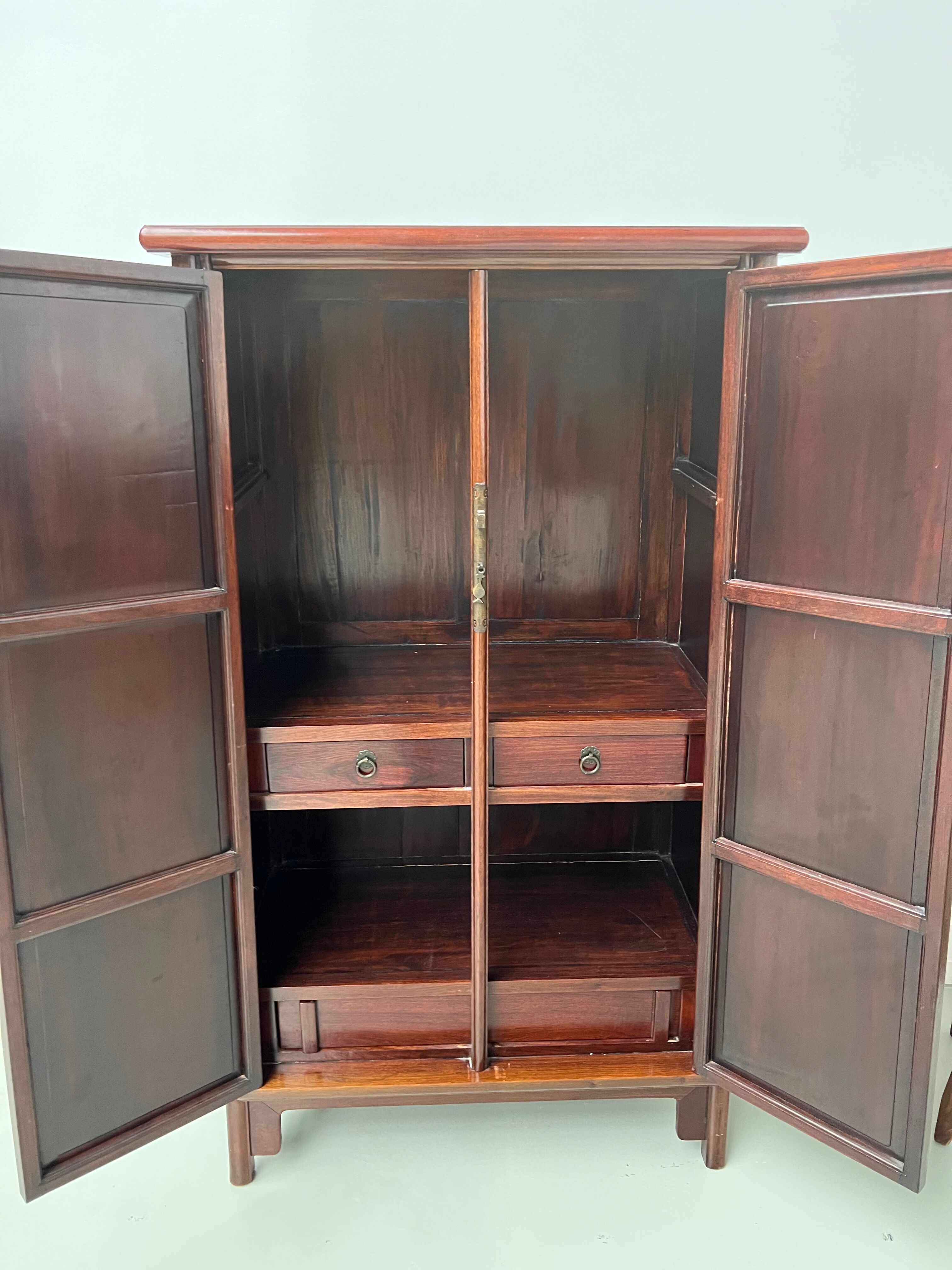 Chinese trapezoidal roller cabinet, made of rosewood.