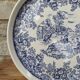Old ceramic plate with scene of life and blue floral decor Van Melle