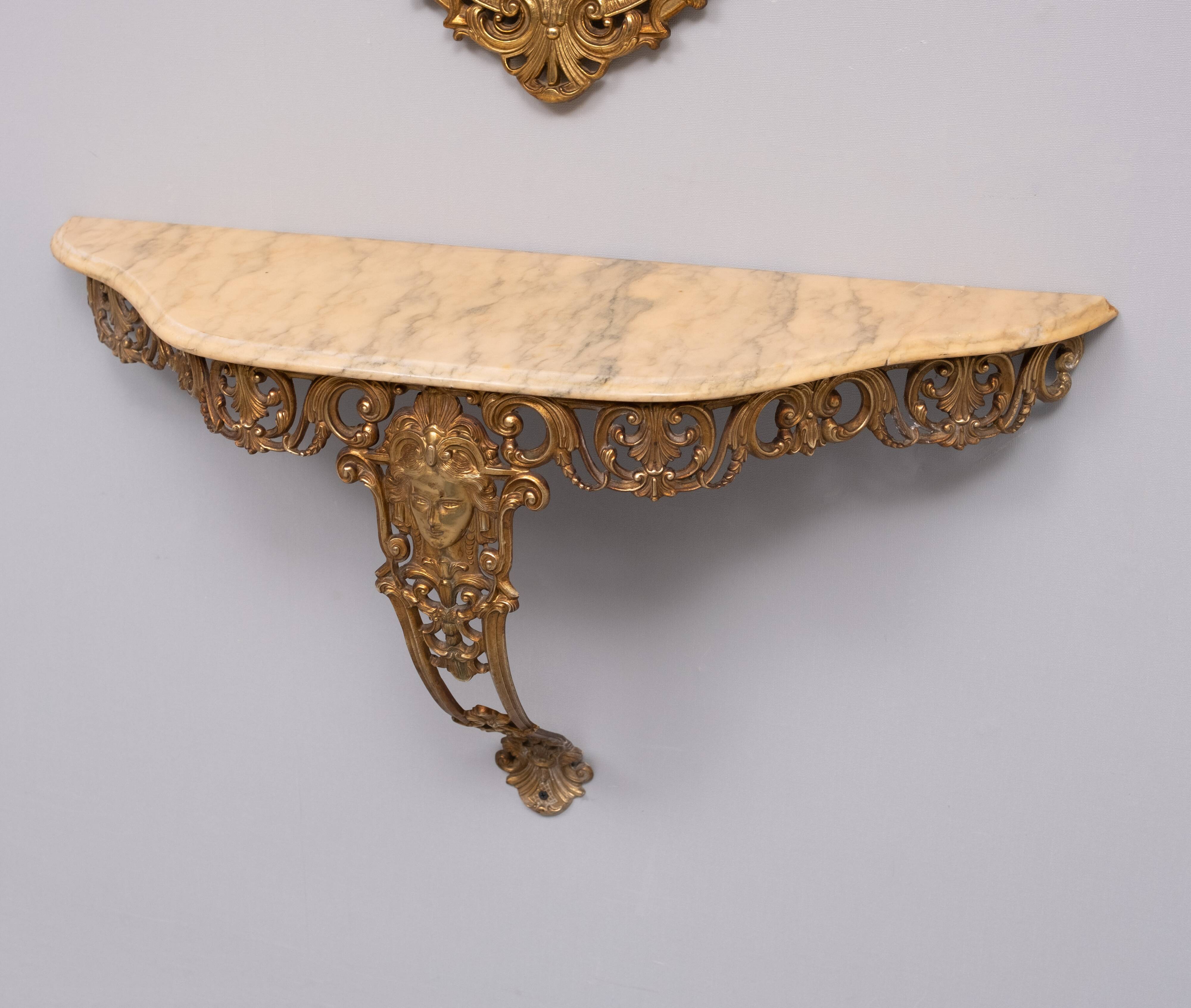 Classic gilded brass console with oval mirror from the 1950s, Italy.