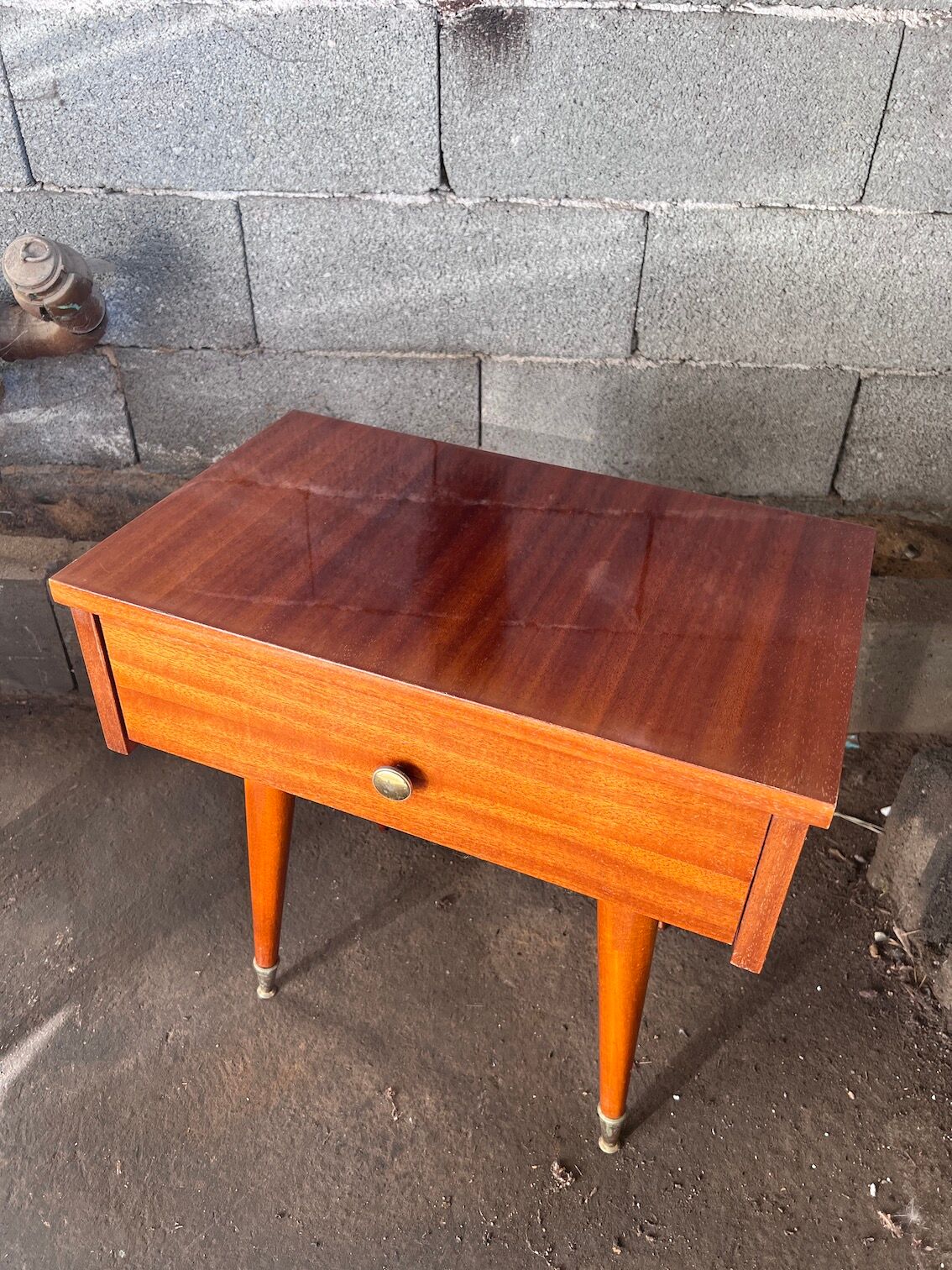Pair of bedside or night tables in lacquered mahogany with compass feet