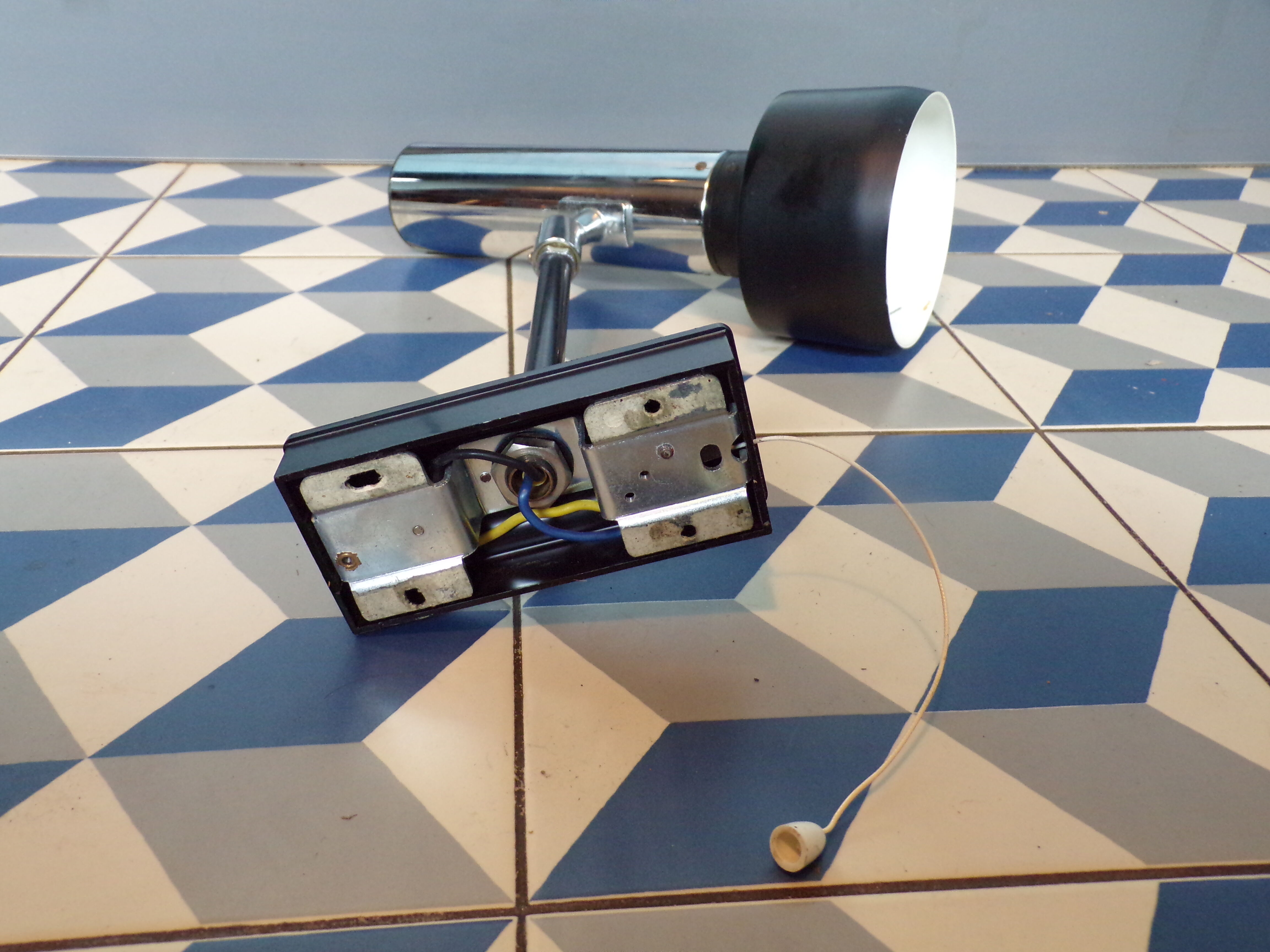 Space age articulated sconce