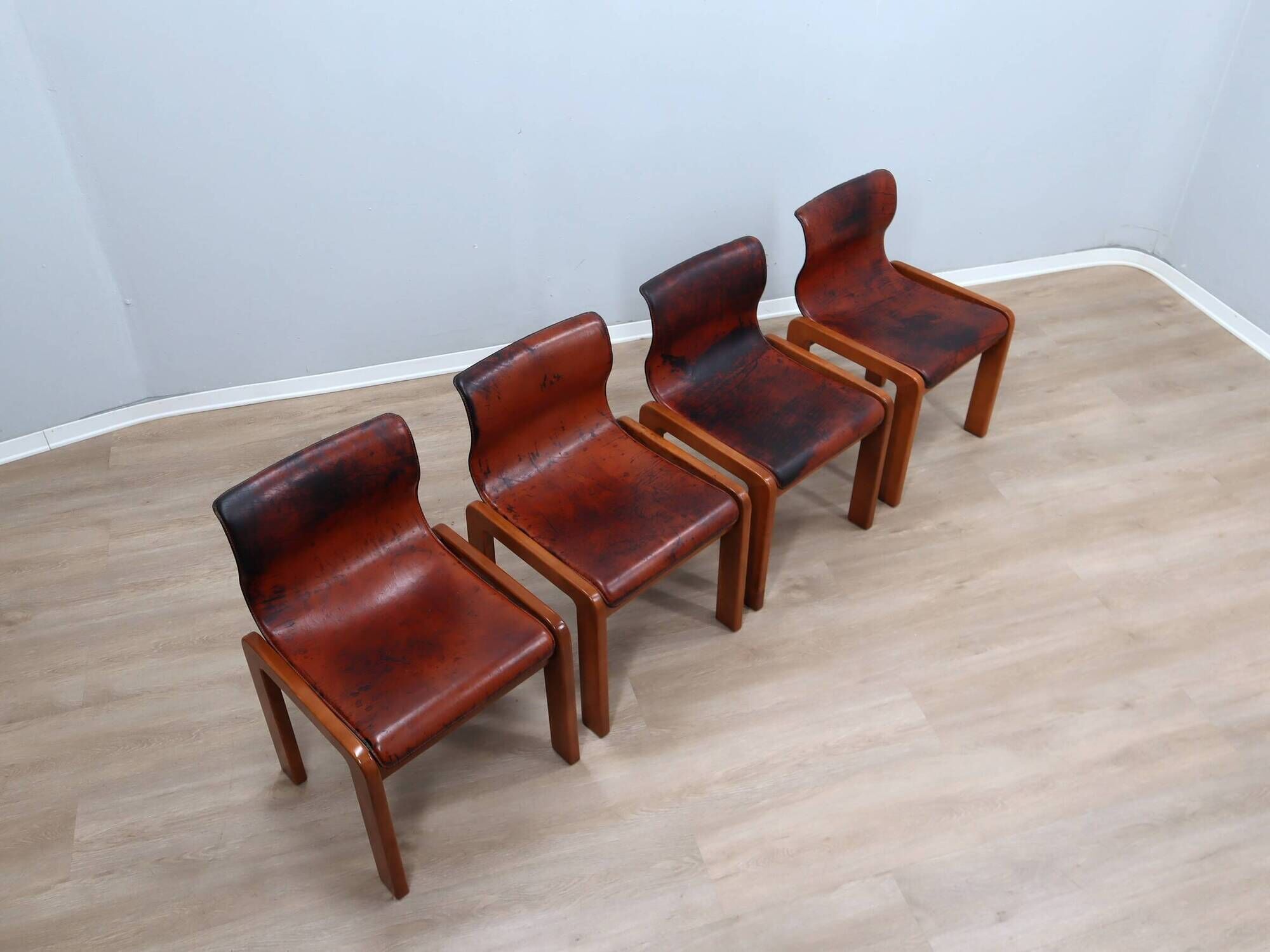 Curved wooden and leather chairs by Afra and Tobia Scarpa from the 1970s, set of 4.
