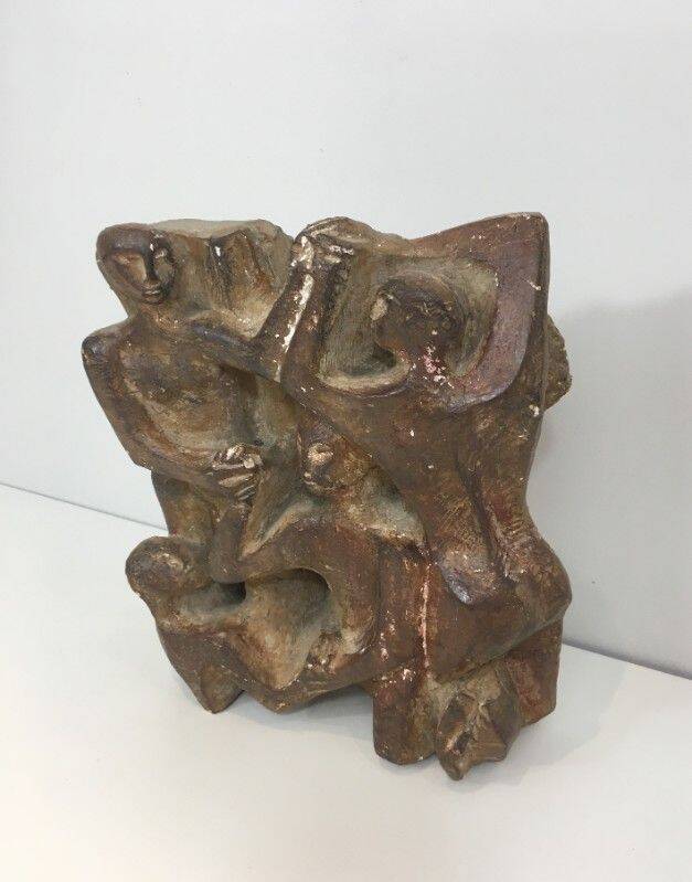 Plaster sculpture depicting a group of 3 figures