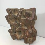 Plaster sculpture depicting a group of 3 figures