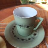 A pair of vintage glazed stoneware cups and saucers.