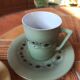 A pair of vintage cups and saucers in glazed stoneware.