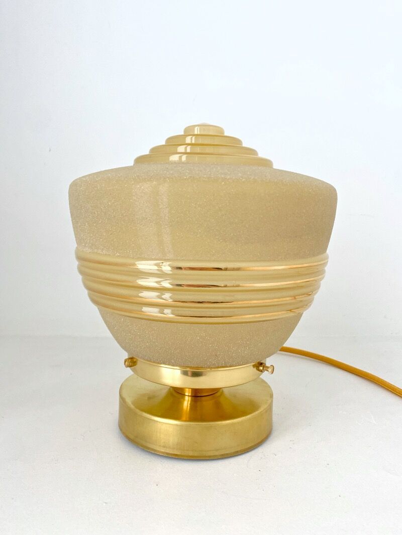 Old globe table lamp in beige and gold glass