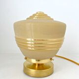 Old globe table lamp in beige and gold glass