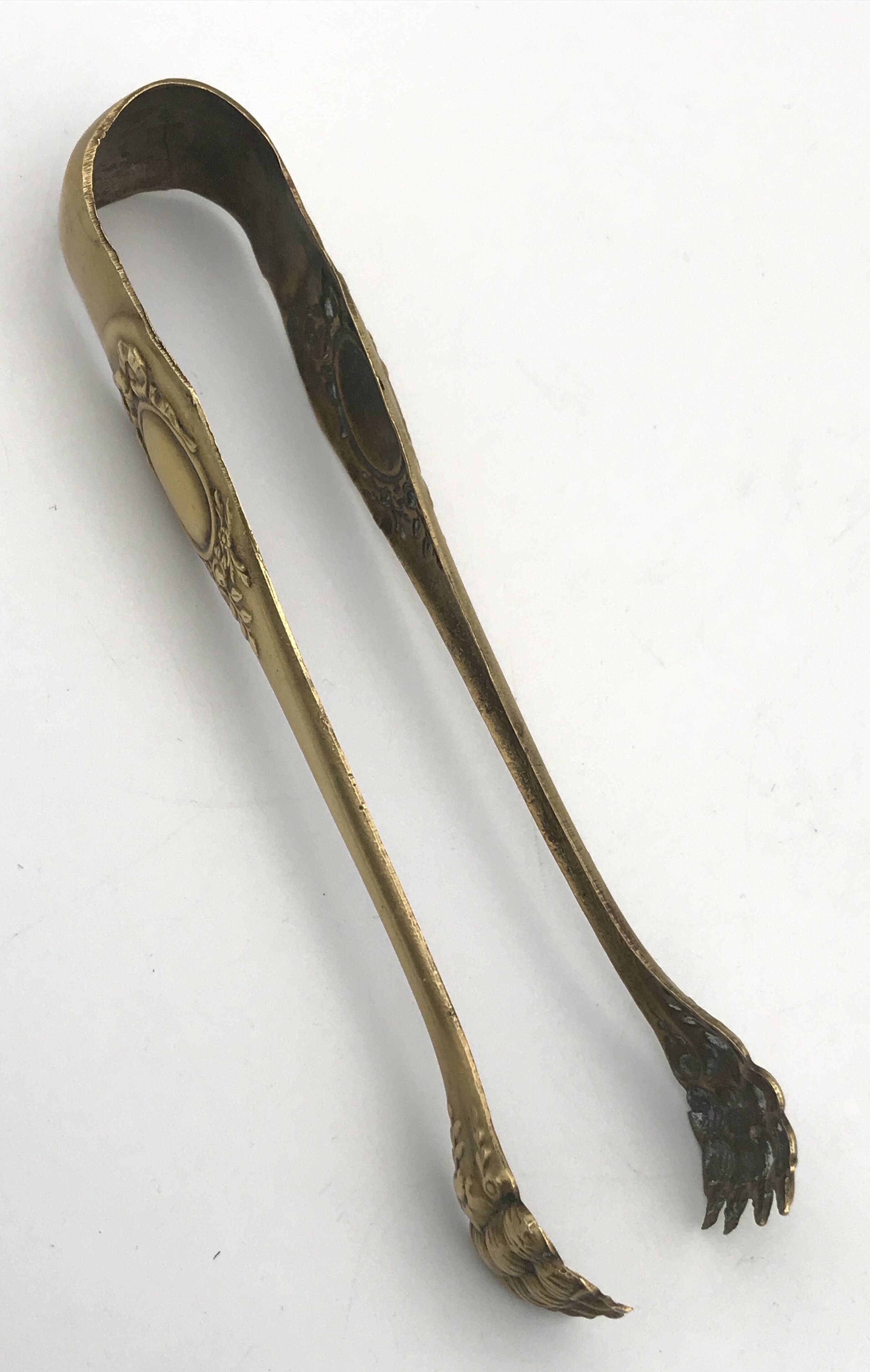 Sugar or ice cube tongs, gold star stamp with lion paw finish