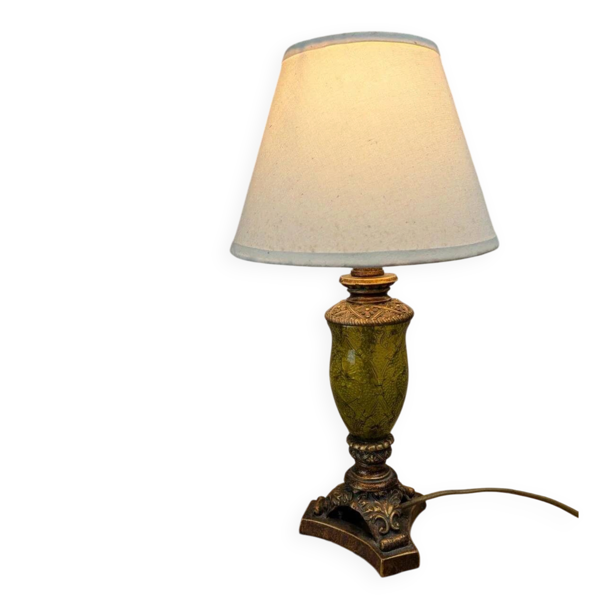 Vintage lamp with bronze imitation base & green relief glass in an antique style.