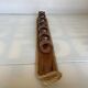 Six wooden egg cups and their rope holder