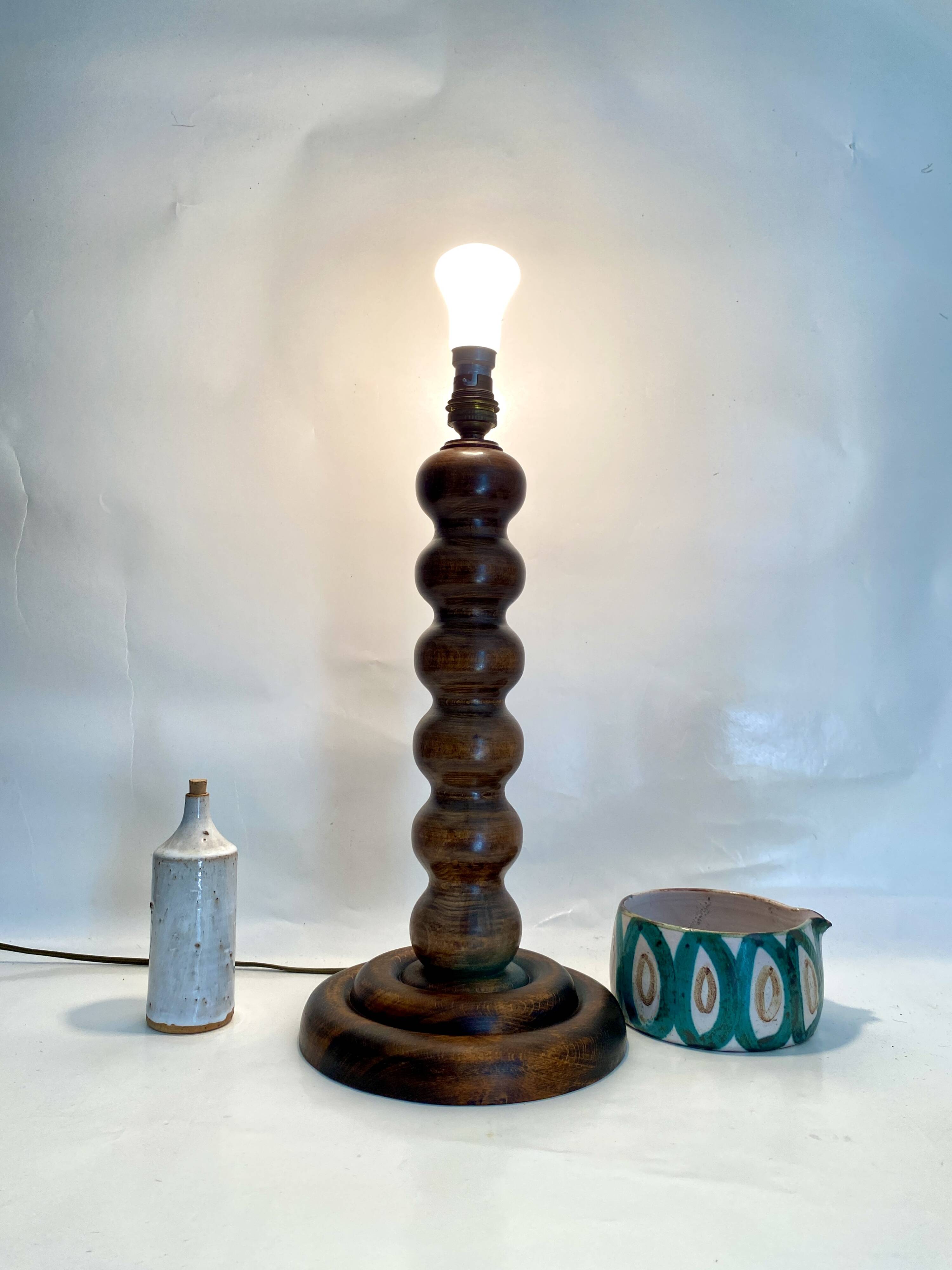 Turned wood lamp with paper shade
