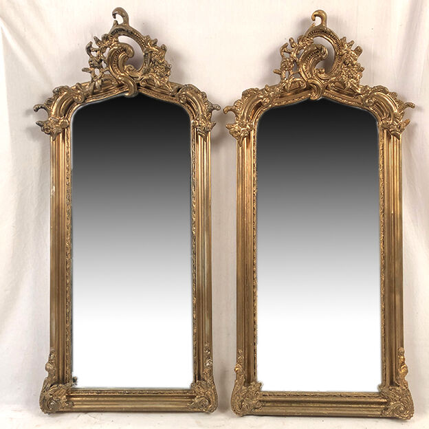 Pair of Louis XV style mirrors, stuccoed and gilded wood, beveled mirrors