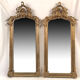 Pair of Louis XV style mirrors, stuccoed and gilded wood, beveled mirrors