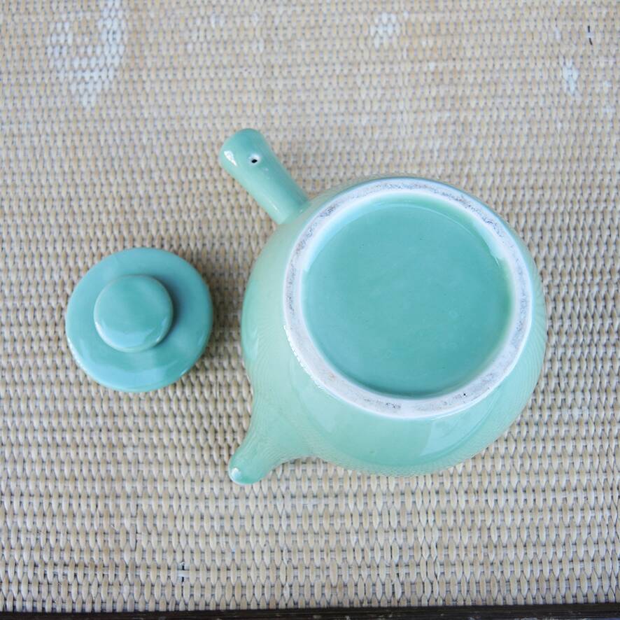 Old green ceramic kyusu teapot