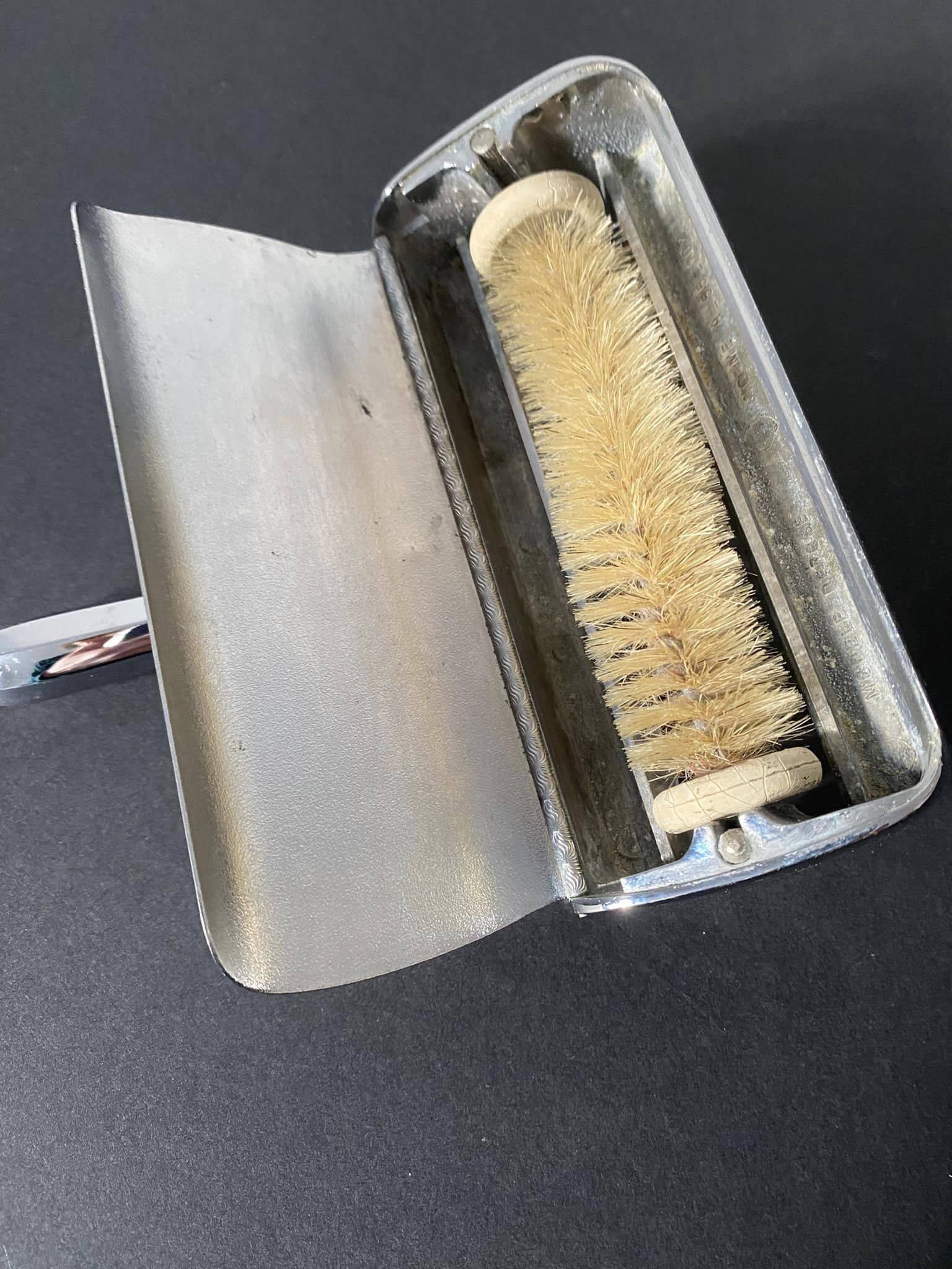 Vintage silver table crumb catcher with stainless steel handle