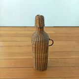 Bottle, old carafe in glass and wicker, 1950s