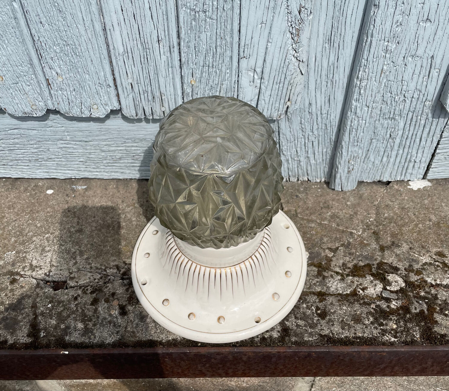 Art Deco ceiling light with a porcelain base.