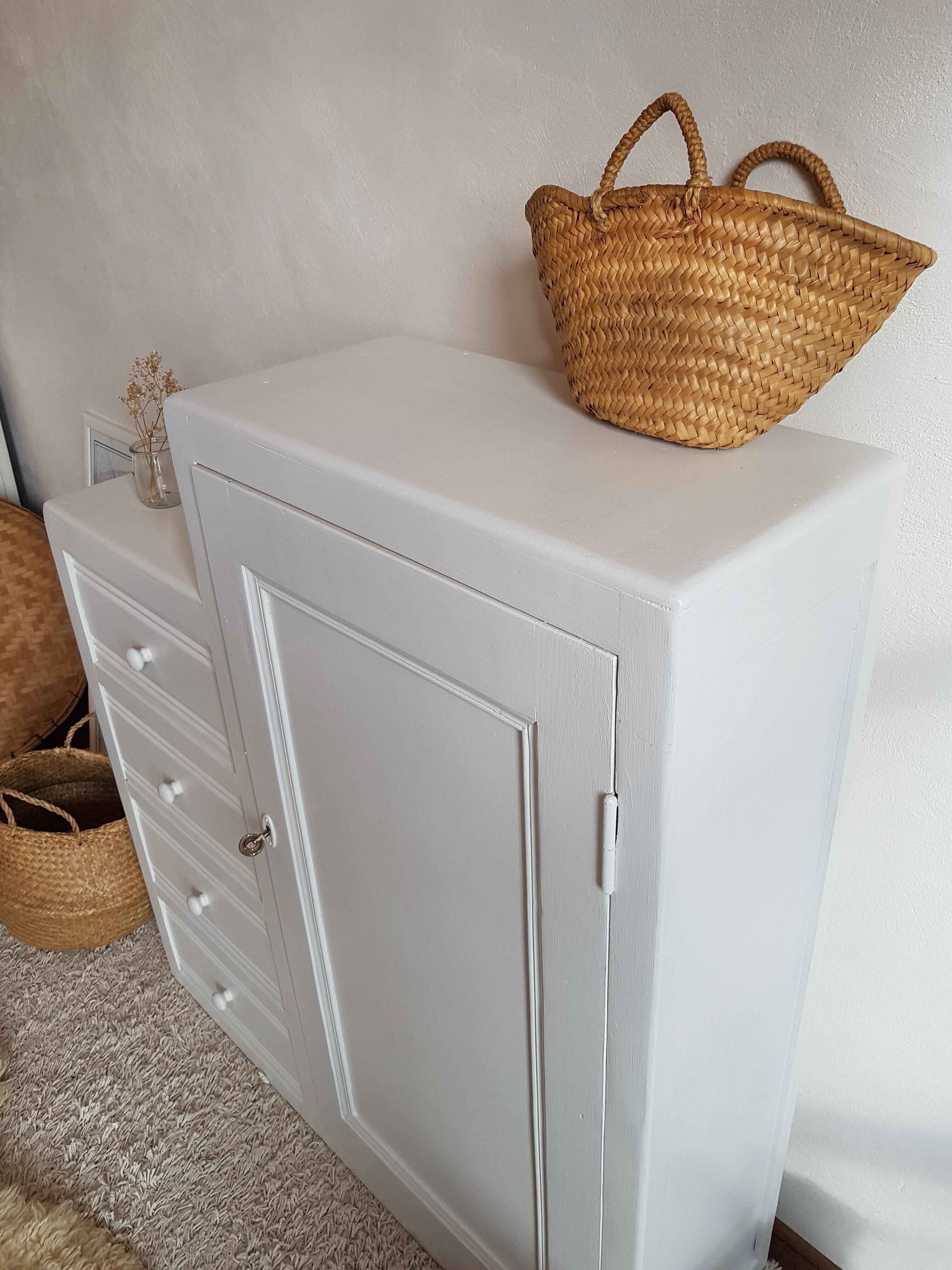 Old white asymmetrical chest of drawers