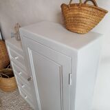Old white asymmetrical chest of drawers
