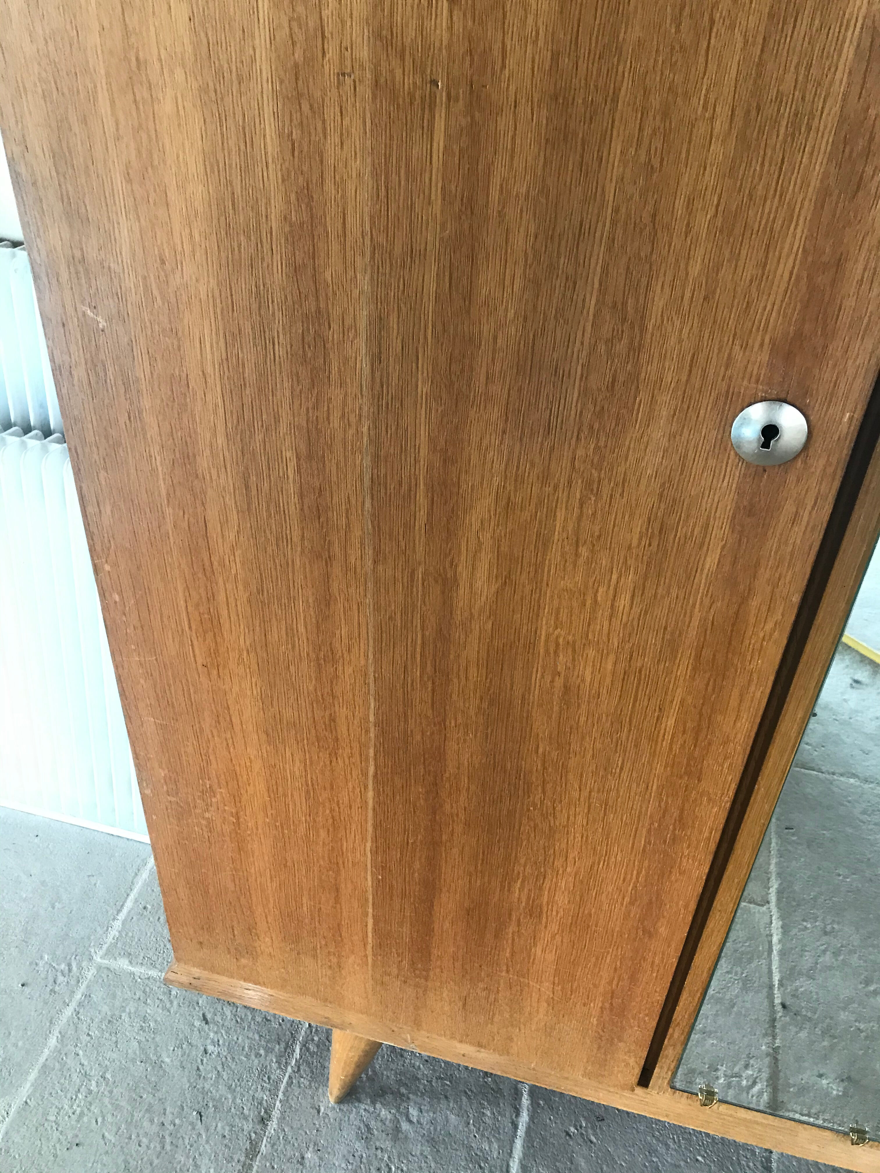 Scandinavian-style wooden cabinet with mirror