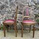 Pair of studded burgundy leather Art Deco chairs