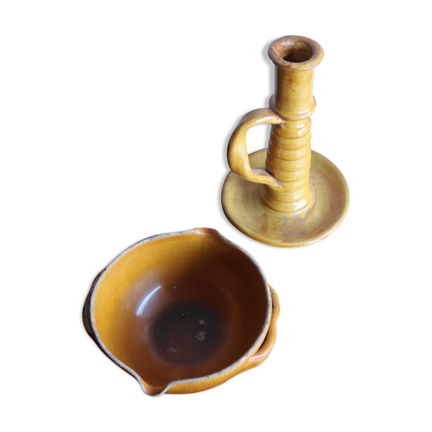 Candle holder and empty pocket in old yellow ceramic