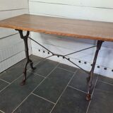 Bistro table with cast iron base and oak top