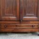 Antique solid wood wardrobe in historical rustic style from the 19th century.