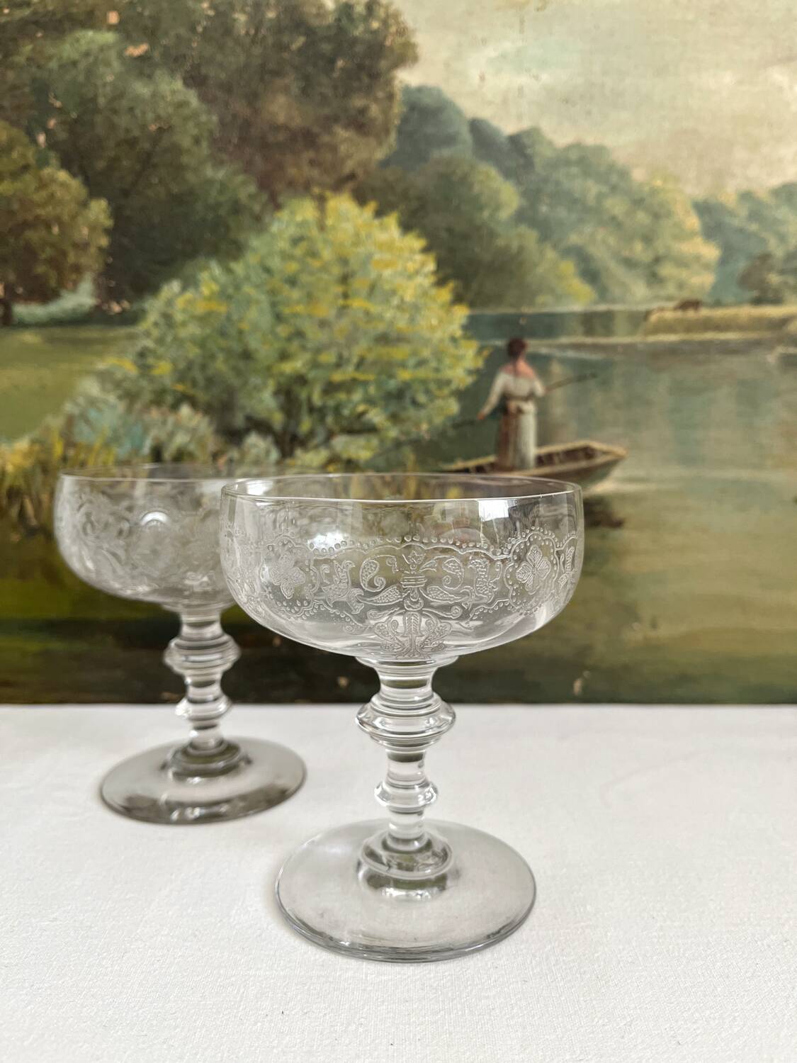 2 antique champagne glasses in engraved glass