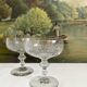 2 antique champagne glasses in engraved glass