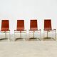 Set of four leather and brass Italian dining chairs