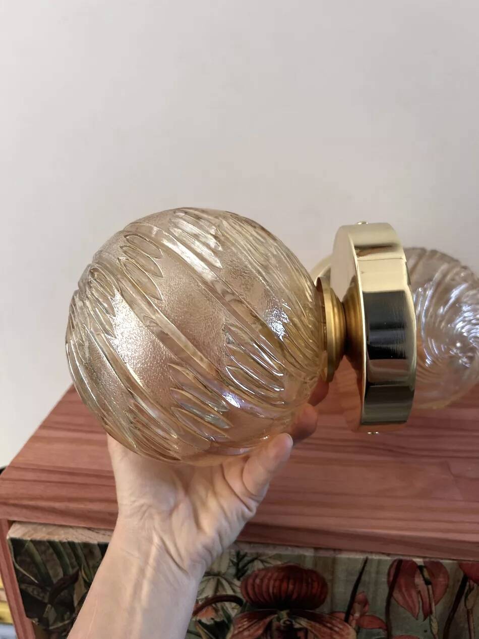 Pair of golden globe wall lights