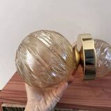 Pair of golden globe wall lights
