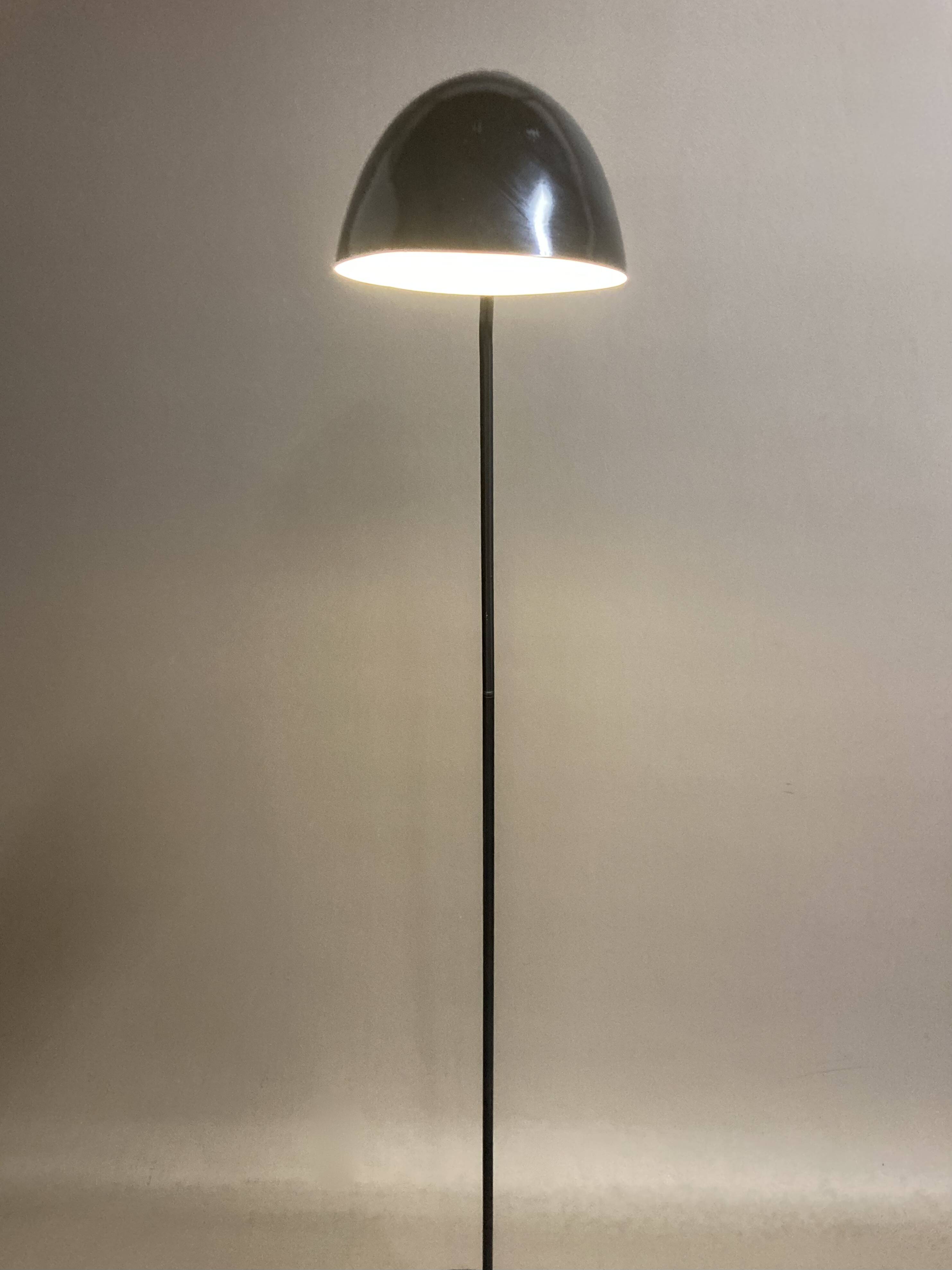 Black metal tripod floor lamp