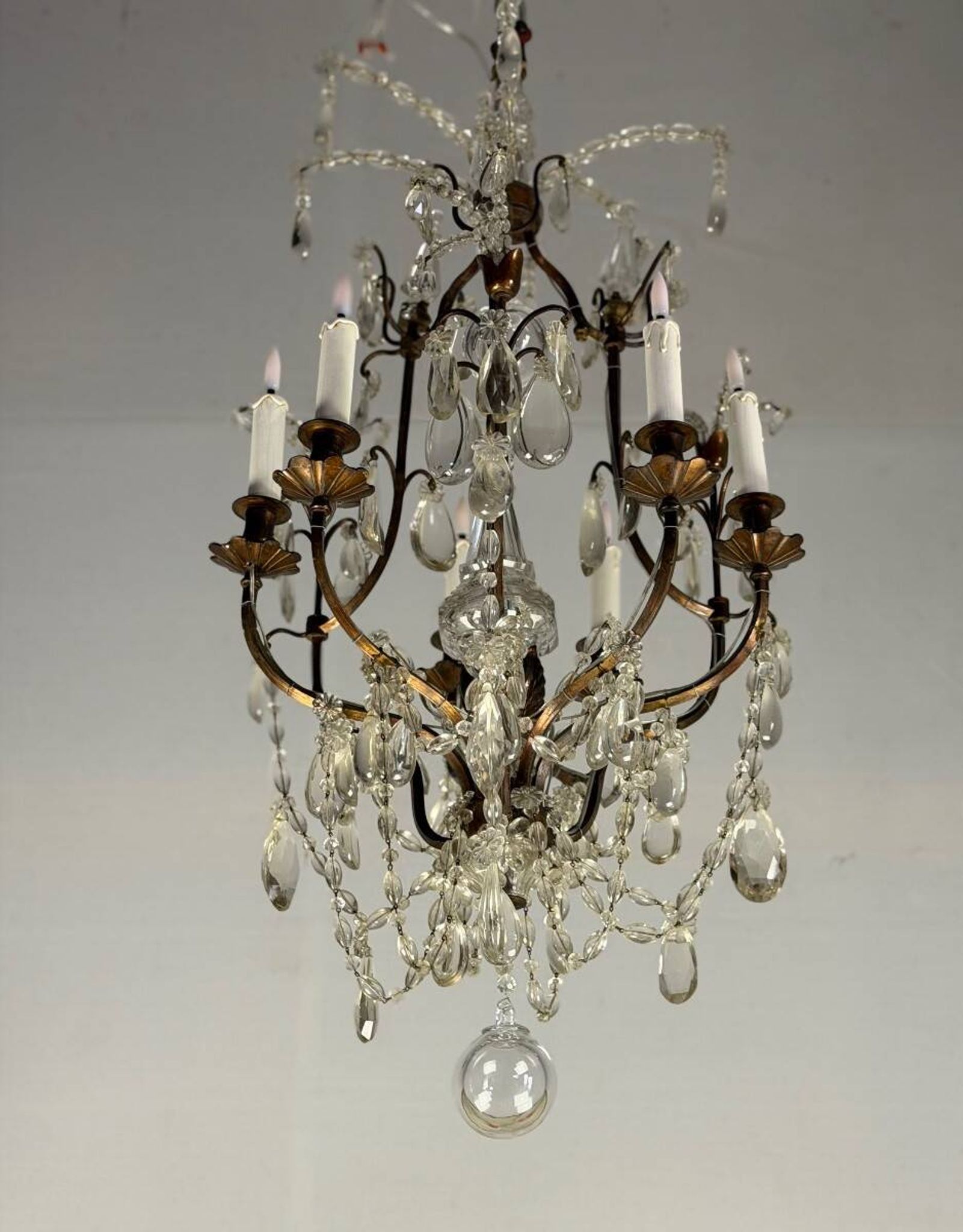 Bronze cage chandelier adorned with crystal drops, circa 1880