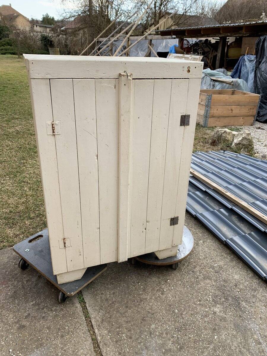 Antique beige-painted solid wood furniture, rustic late 19th-century cabinet with a single door.