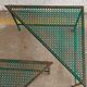 Triangular coffee table in perforated metal Mathieu Mategot